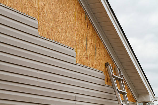 Professional Emergency Siding Repair technician working in Parker, FL
